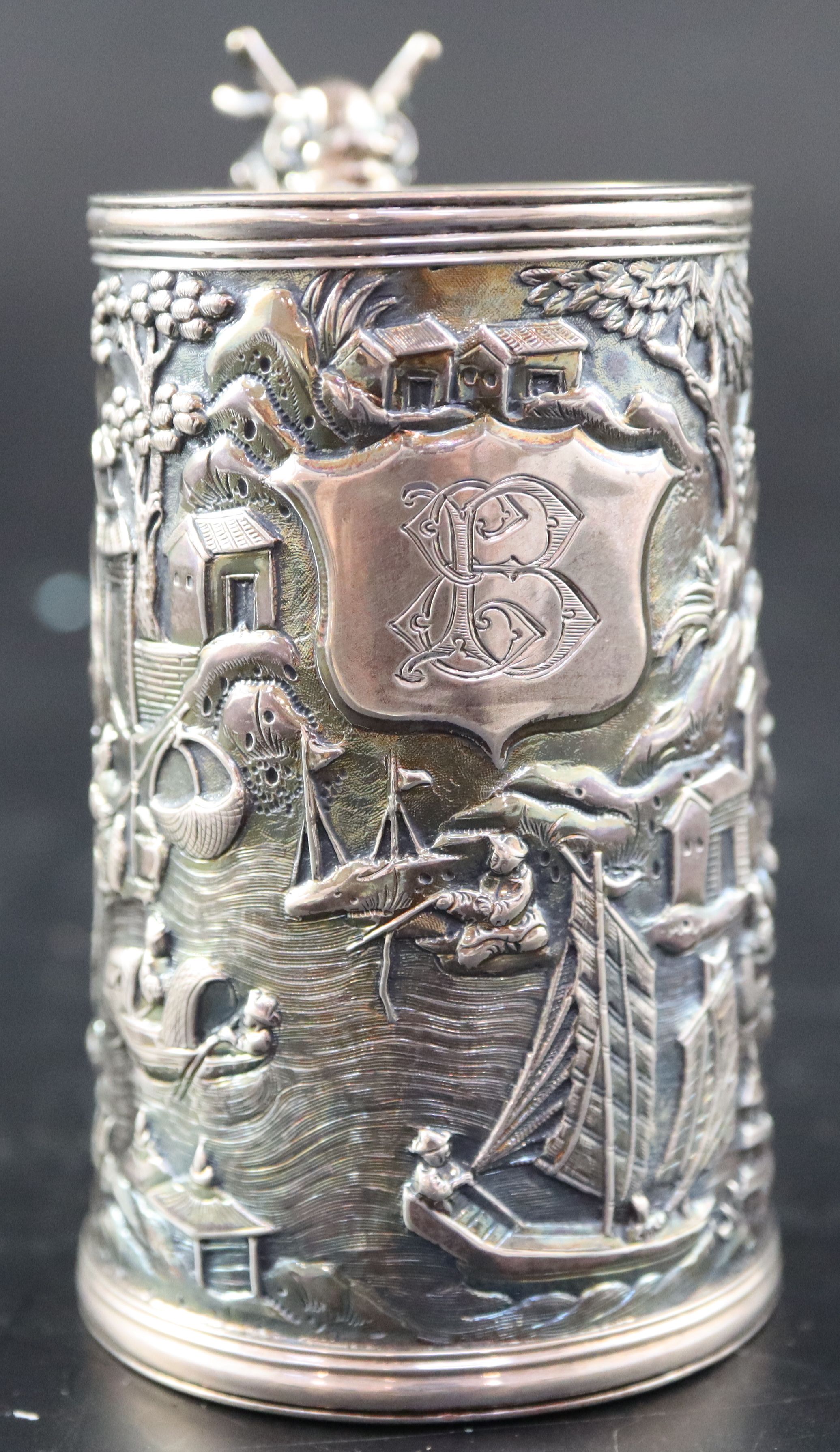 An early 20th century Chinese Export white metal christening mug by Wang Hing, with dragon handle